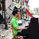 Der Musiker mit seinem Klavier in den Trümmern von Damskus.