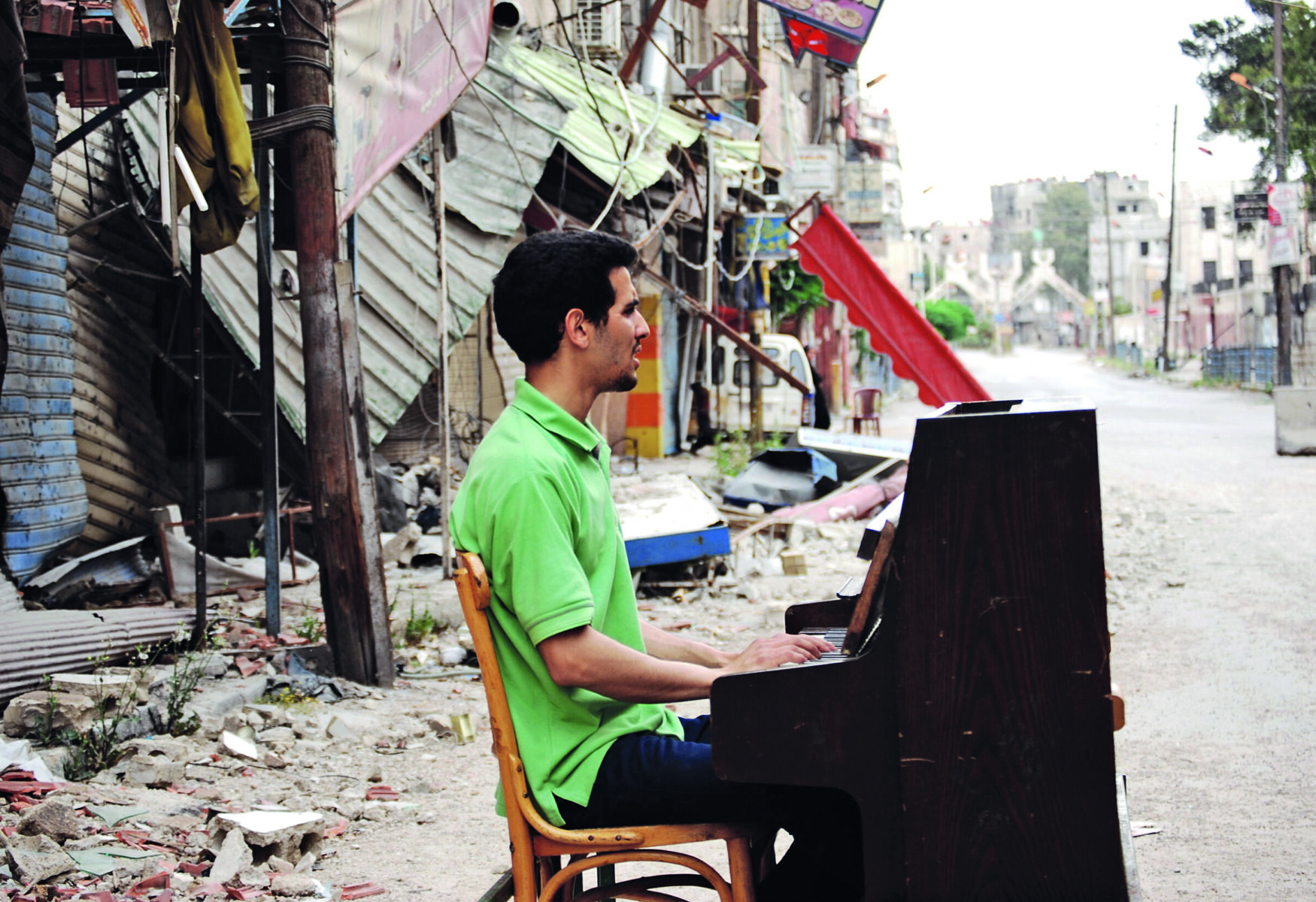 Der Musiker mit seinem Klavier in den Trümmern von Damskus.